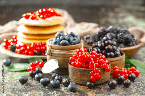 Berries from the garden, in summer on an old background.