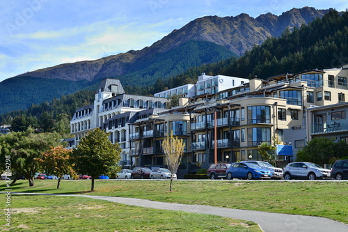 Garden Queenstown With house and car park and mountain background