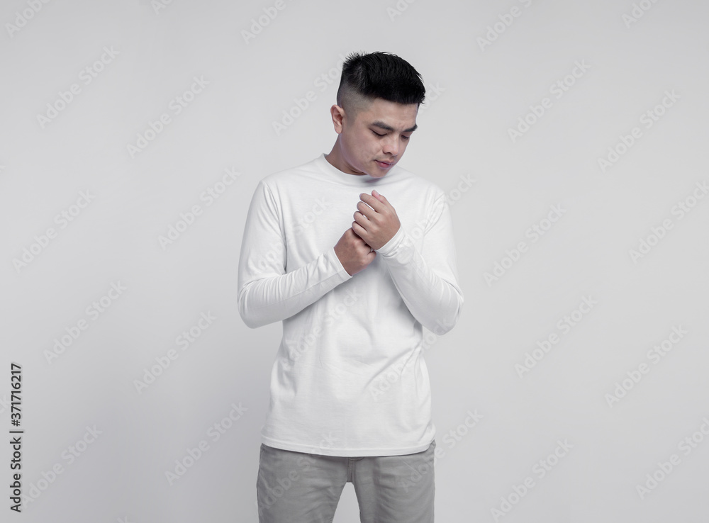 Young handsome man posing wearing white long sleeve t shirt with mockup concept Young handsome man posing wearing white long sleeve t shirt with mockup concept