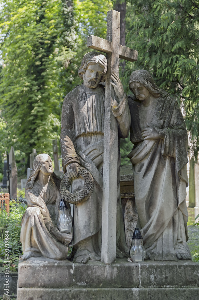 Statue of Christ Carrying the cross, decorating the Lychakiv Cemetery in Lviv, Ukraine Statue of Christ Carrying the cross, decorating the Lychakiv Cemetery in Lviv, Ukraine