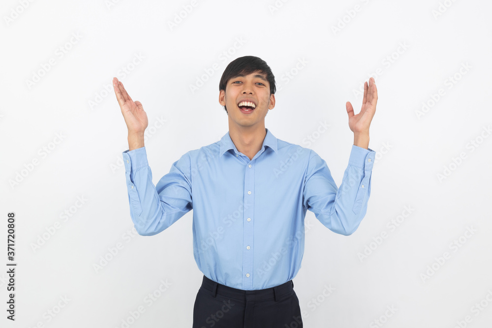Excited young business Asian man raising his fists with happy delighted face, celebrating success isolated on white background. Excited young business Asian man raising his fists with happy delighted face, celebrating success isolated on white background.