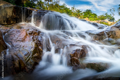 Small waterfall and stone with water motion.