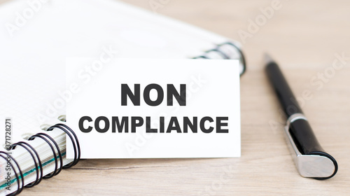 text NON COMPLIANCE on the white paper note list