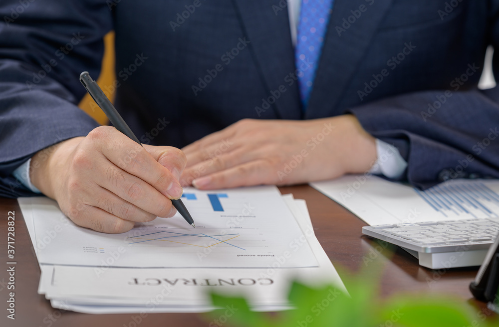 Finance and business concept. The hand of the businessman holding the financial graph. Finance and business concept. The hand of the businessman holding the financial graph.
