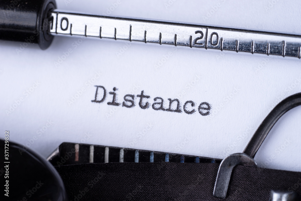 Distance on white sheet in vintage typewriter