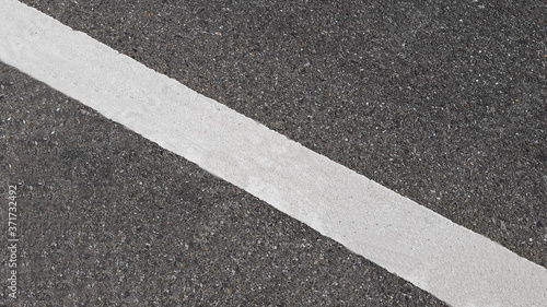 Wallpaper Mural White paint line on asphalt road surface, with gray color guidelines on street, close up texture background concept, countryside Thailand. Torontodigital.ca