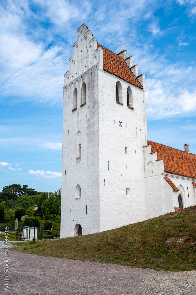 The steeple tower of Falsterbo church standing almost at the beach in the south west tip of Sweden