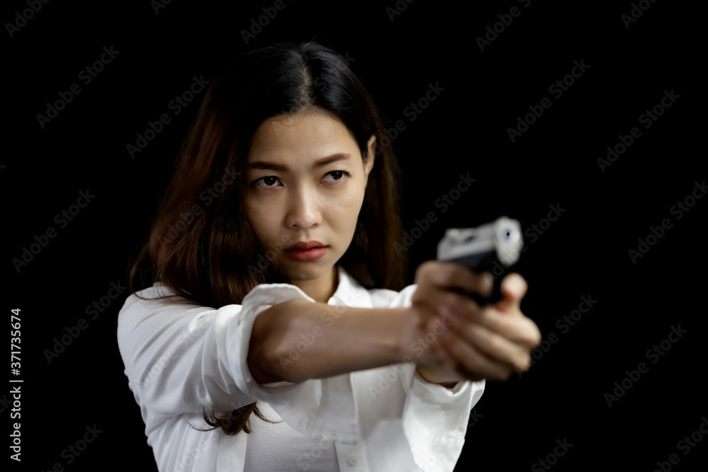 Portrait asian woman hand aiming a pistol gun Portrait asian woman hand aiming a pistol gun