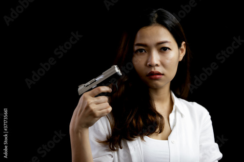 Portrait asian woman hand holding a pistol gun