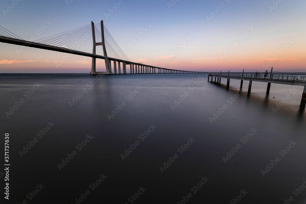 The Vasco da Gama Bridge is a cable-stayed bridge flanked by viaducts and spans the Tagus River in Parque das Nações in Lisbon, the capital of Portugal. It is the longest bridge in the European Union