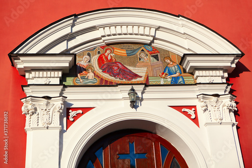 Church entrance details . Arched doorway decorated with icon photo
