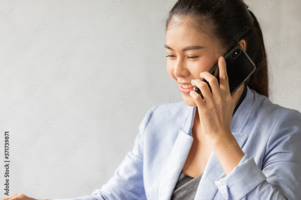 woman talking on mobile phone with feeling success woman talking on mobile phone with feeling success