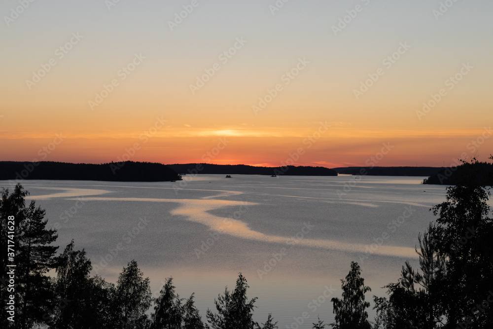 Colorful summer sunset over a lake in Lappeenranta, Finland 