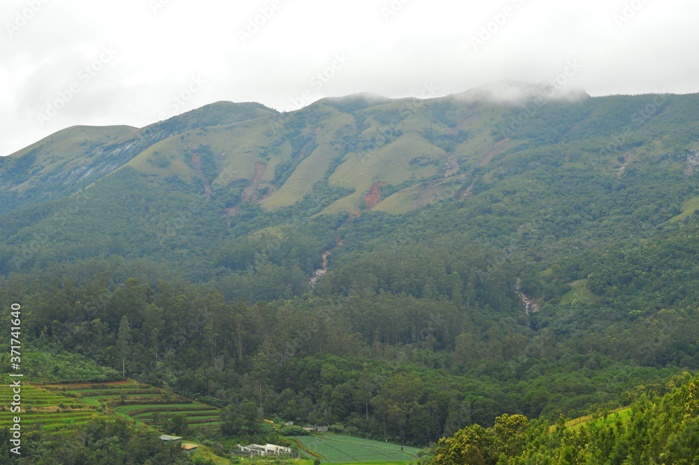 Fototapeta premium distant mountains with landslides during rains