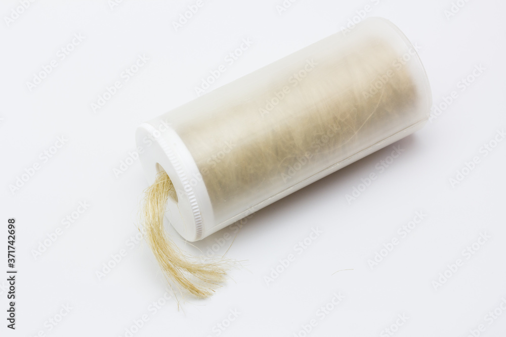 Bote con rollo de estopa para fontaneros Bote con rollo de estopa para fontaneros