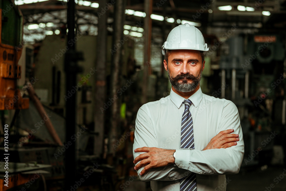 Senior Project manager working in industrial factory Senior Project manager working in industrial factory