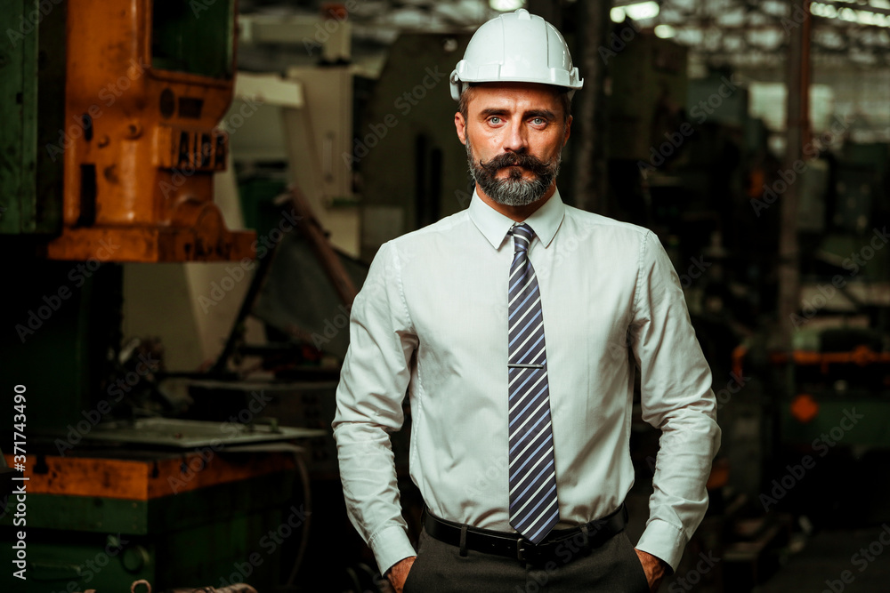 Senior Project manager working in industrial factory Senior Project manager working in industrial factory
