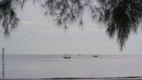 fishing boats are moored in the sea photo