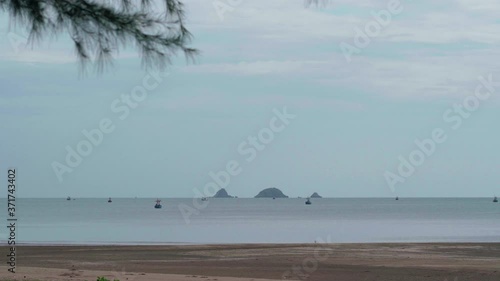 Many fishing boats are moored in the sea photo