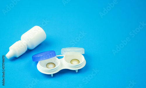 Contact lens on blue background
