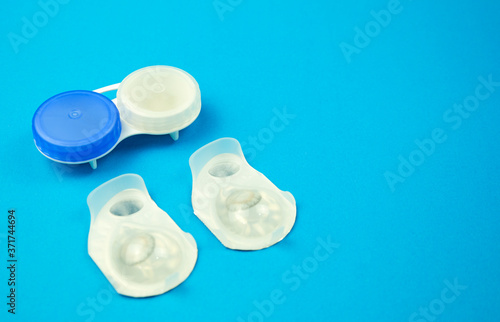 Contact lens on blue background