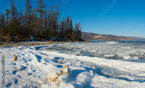 Sayan mountains in the fog on lake Baikal.