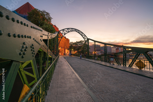 Wroclaw, Poland August 5, 2020; Cityscape of Wrocław at dusk on the Odra River.