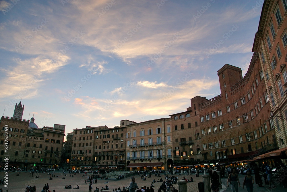 Old buildings in Piazza del Campo panorama view in Siena, Italy.