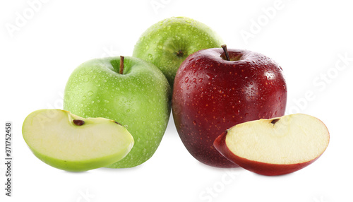 Cut and whole fresh apples on white background