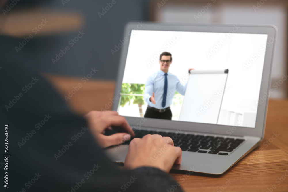 Woman having online video consultation with business trainer at table, closeup