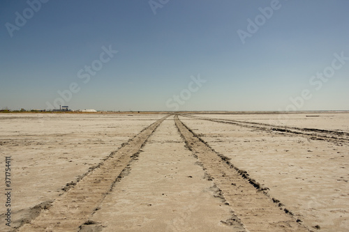 Close-up of sand on the beach of the salty pink lake Bursol  Altai Territory .