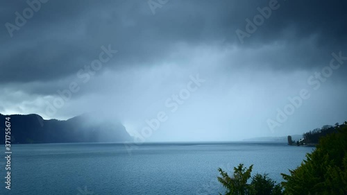 Rain front in the Alps mountains. Switzerland. Pilatus peak in the clouds. Lake Lucerne.