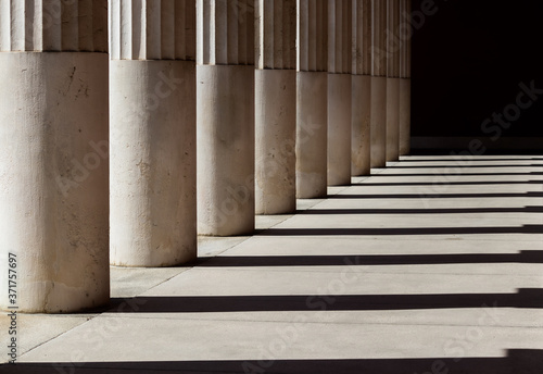 columns in a row with black shadows