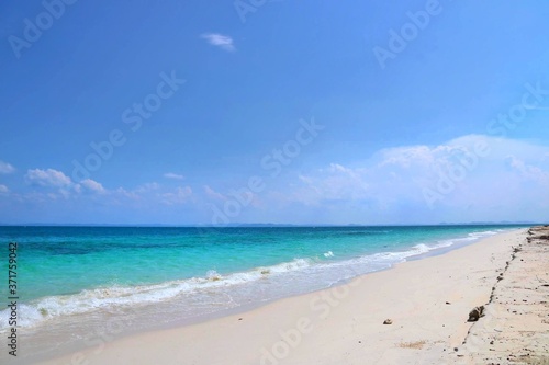 tropical beach with blue sky © TeckChiang