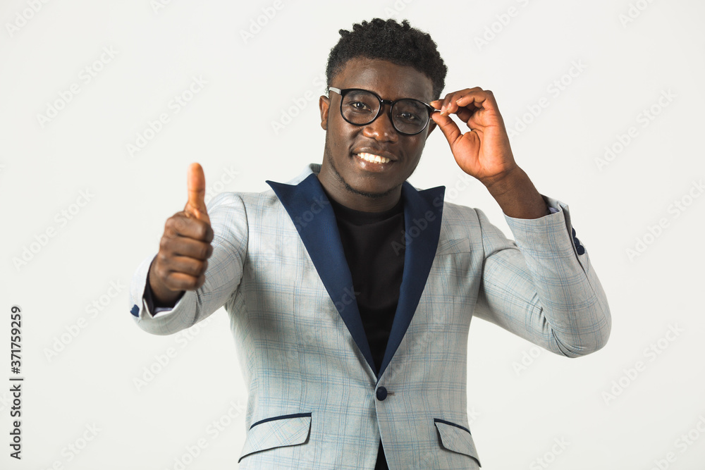 handsome young african male in a jacket on a white background wearing glasses handsome young african male in a jacket on a white background wearing glasses