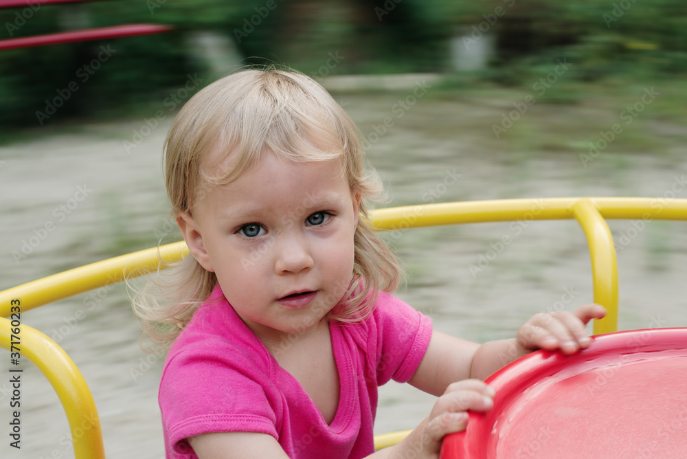 baby girl playing in the children playground baby girl playing in the children playground