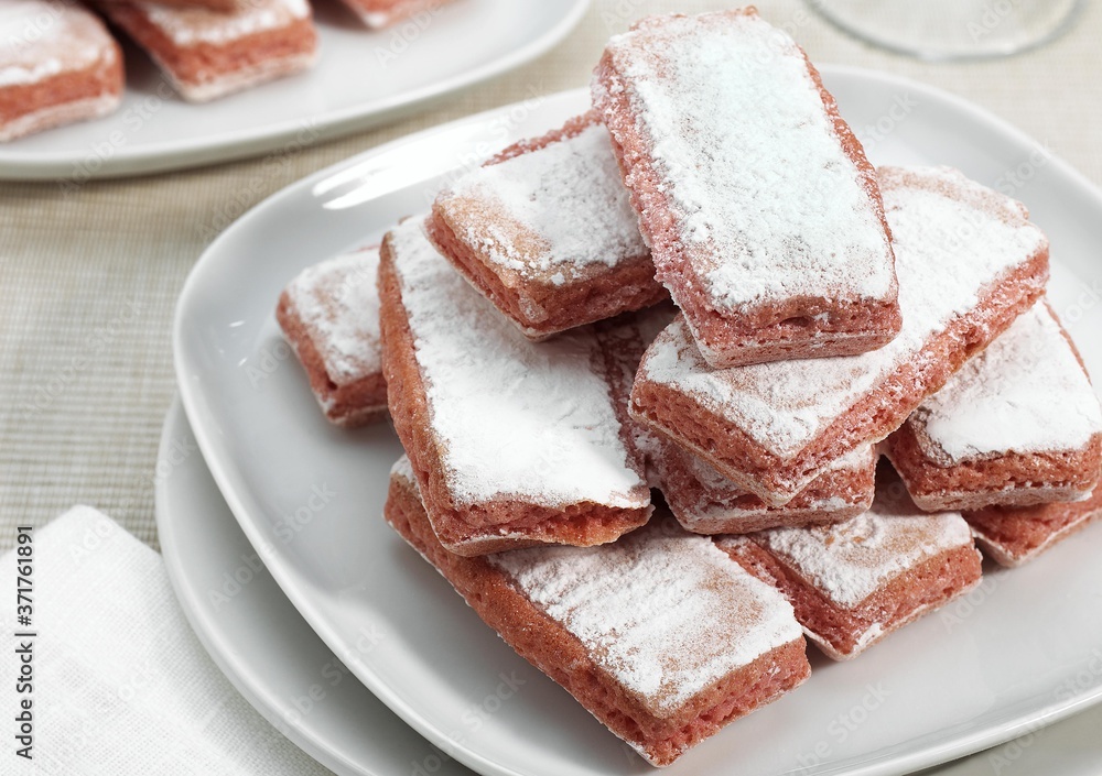 Biscuit Rose de Reims, Pink Biscuit found in French cuisine, It is customary to dip the biscuit in champagne Biscuit Rose de Reims, Pink Biscuit found in French cuisine, It is customary to dip the biscuit in champagne