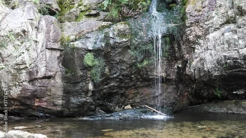 waterfall flowing into pond along high falls trail in the talladega national forest, alabama, usa