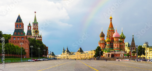Rainbow over Red Square in Moscow after a thunderstorm, panoramic view. Moscow Kremlin, St. Basil's Cathedral, Spasskaya Tower