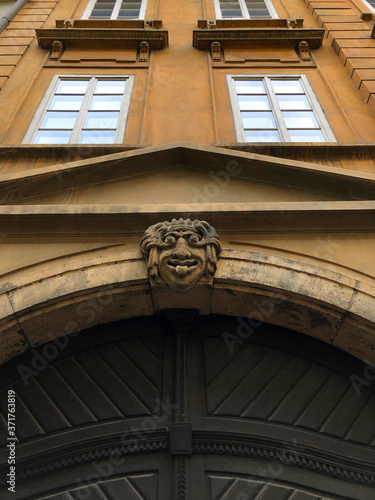 Photography Gothic building facade with funny face icon