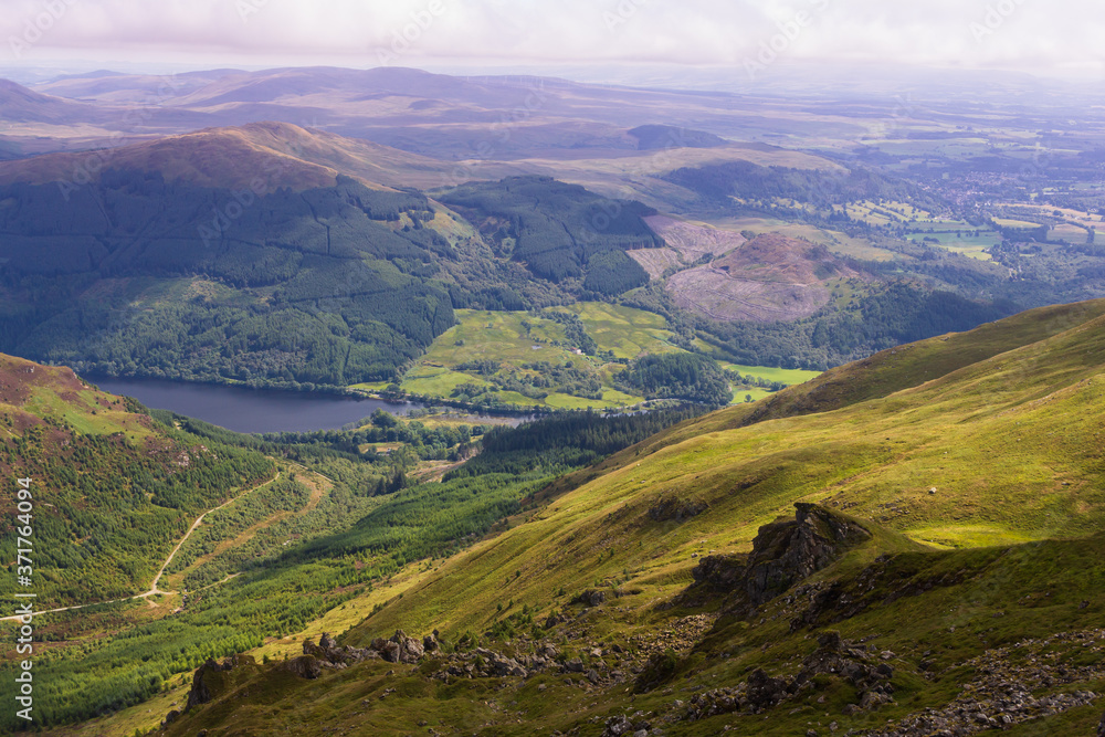 Views of Stirlingshire in Scotland on a lovely summersday from the top of the mountain Ben Ledi
Views of Stirlingshire in Scotland on a lovely summersday from the top of the mountain Ben Ledi