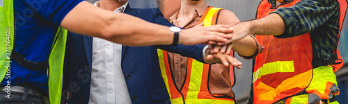 Wallpaper Mural Professional success of group engineer container cargo foreman in helmets standing and putting stack their hands together support in teamwork.logistic and business export Torontodigital.ca