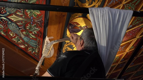 close up Men painting mural religious fresco in Meteora greece