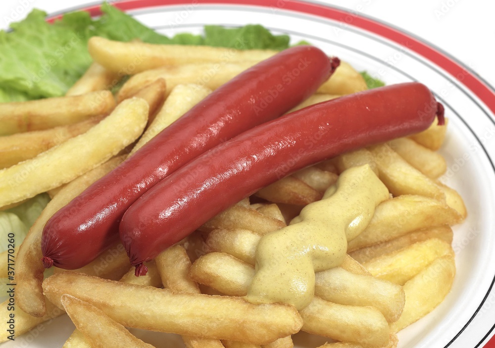 Sausages, French Fries and Moutarde in a Plate Sausages, French Fries and Moutarde in a Plate