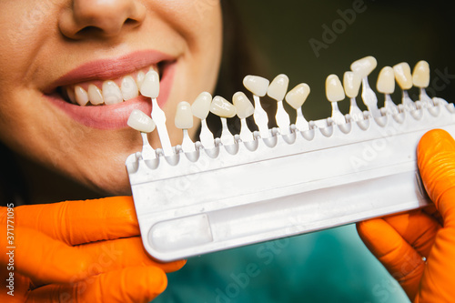 Close-up of female patient at dentist. Dental medical care concept. 