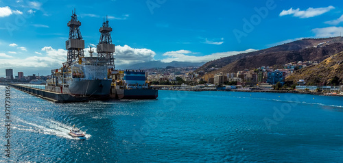 Looking back to the port of Santa Cruz, Tenerife as the ship sails away on a sunny day