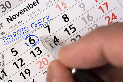 Check your thyroid gland with a doctor appointment into the calendar photo