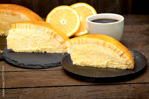 A moment to enjoy, a creamy orange cake and a cup of coffee