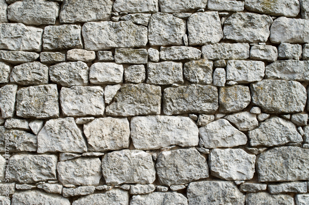 Obraz premium Old white stone wall closeup