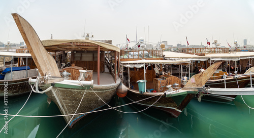 Traditional wooden boats in the Corniche marina at Doha.